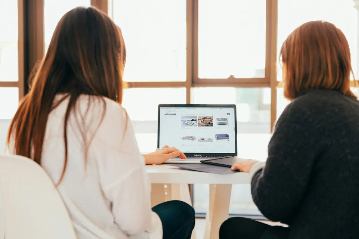 Two ladies working online for sunpact solar company